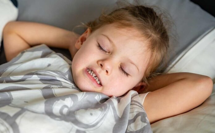 A little girl teeth grinding while she is asleep.